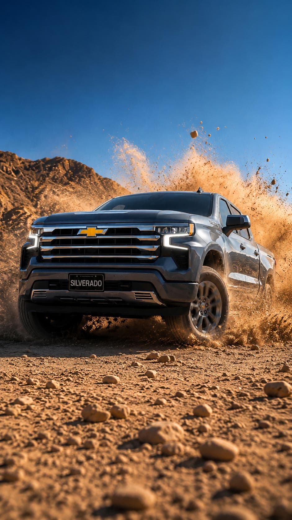 Chevrolet Silverado black truck in mountain terrain