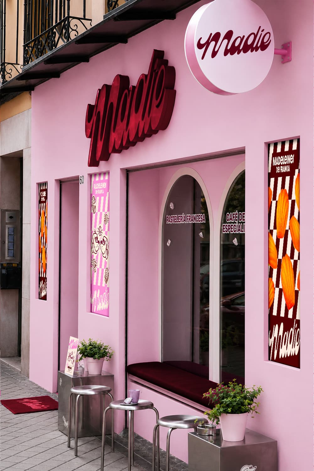 Storefront entrance with neon sign and pink archway