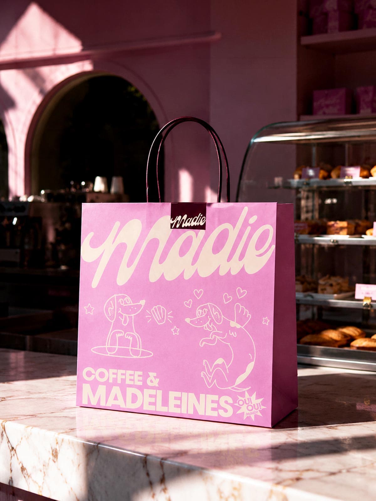 Pink branded takeaway bag