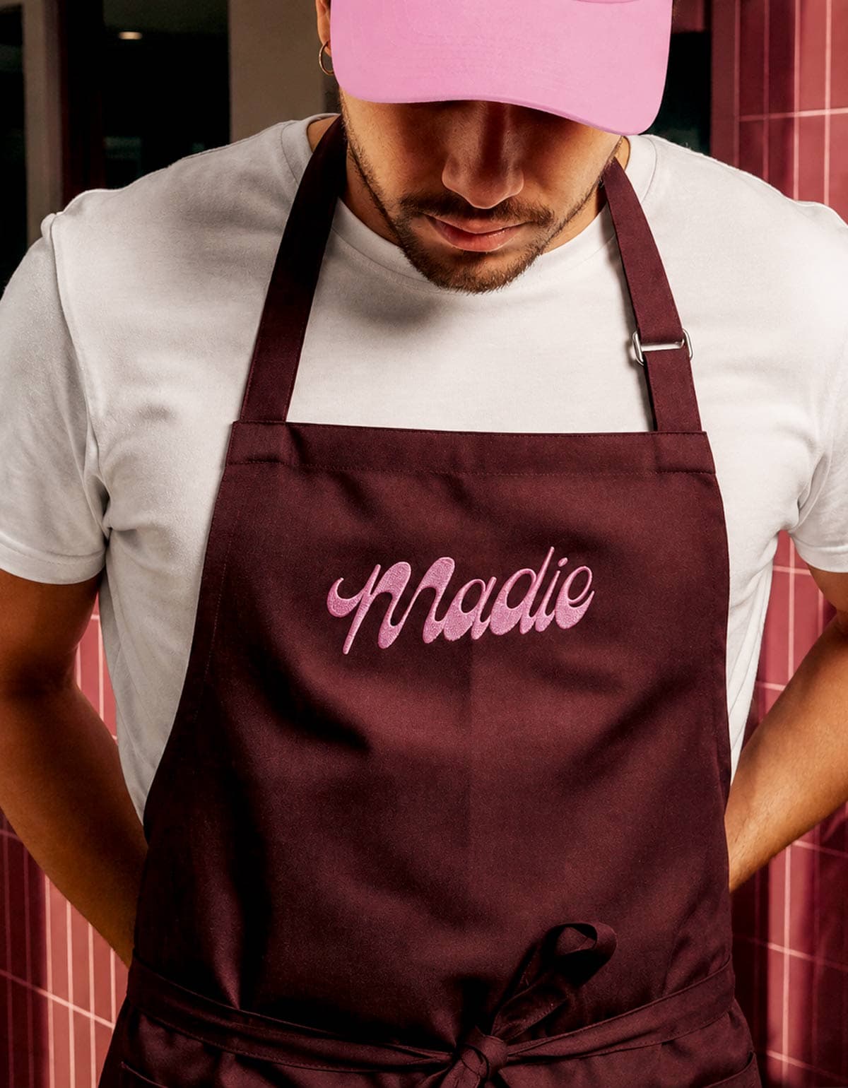 Baker in pink cap and brown apron