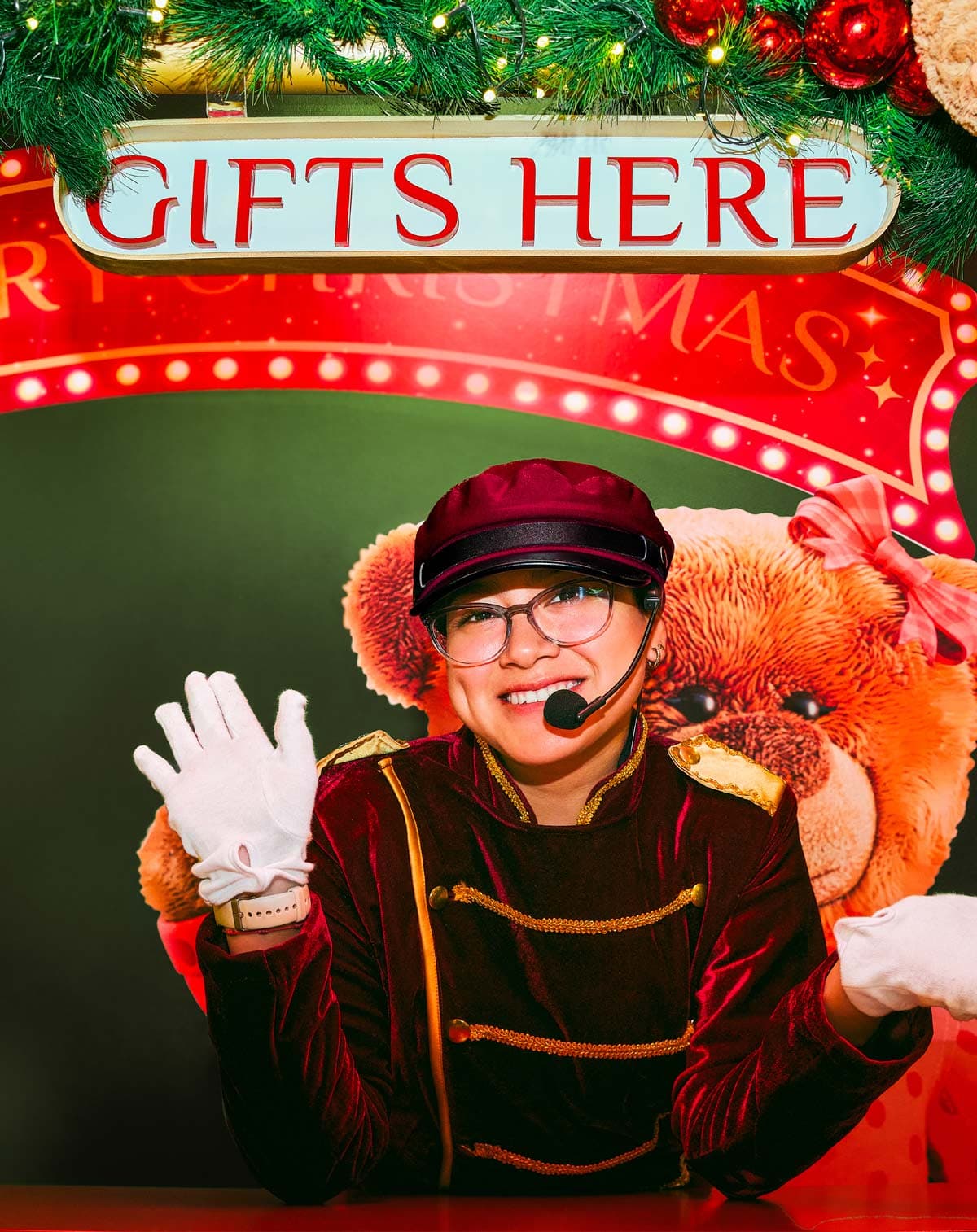 Festive character greeting at Gifts Here window