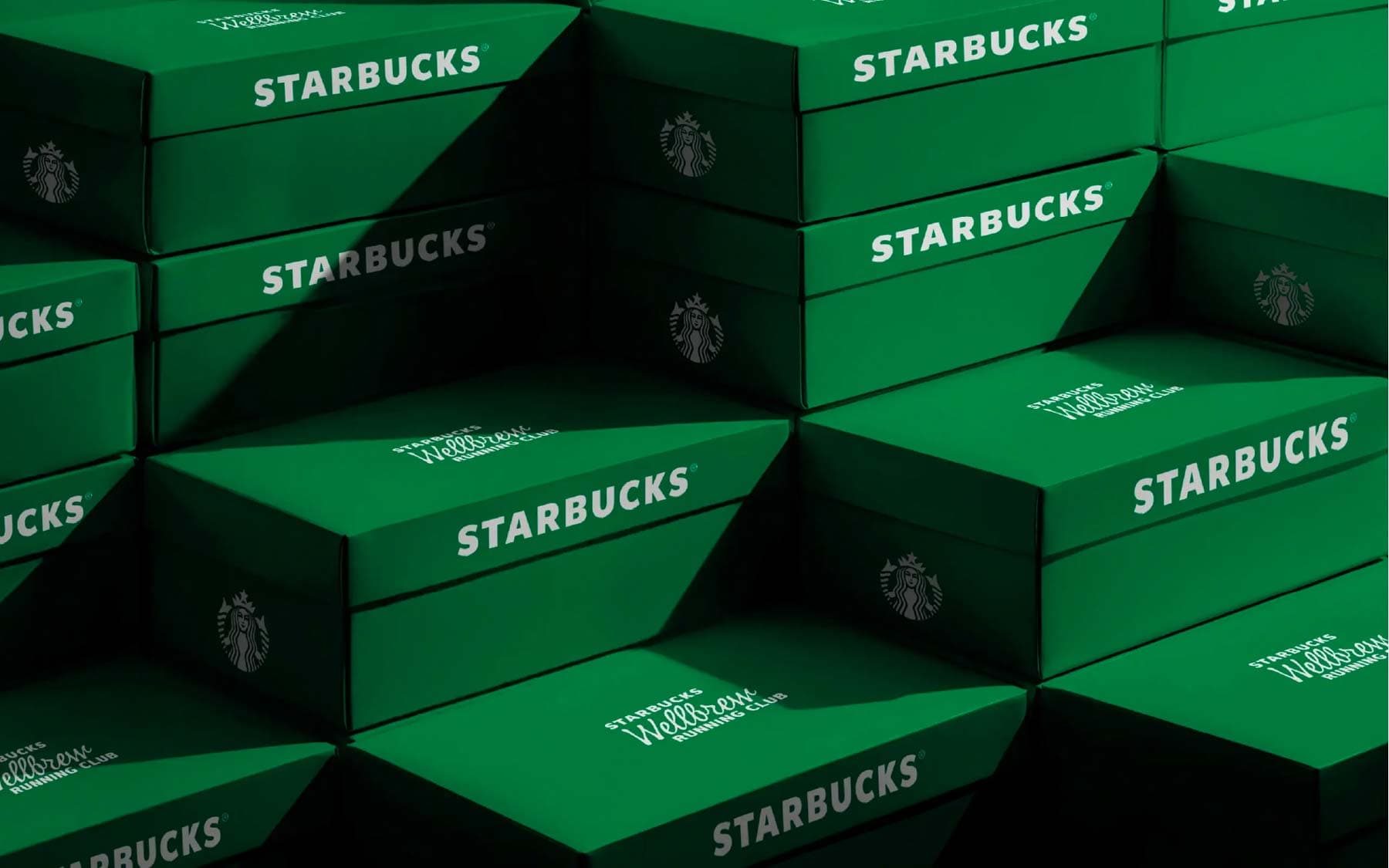 Stack of green Starbucks Wellbrew branded packages
