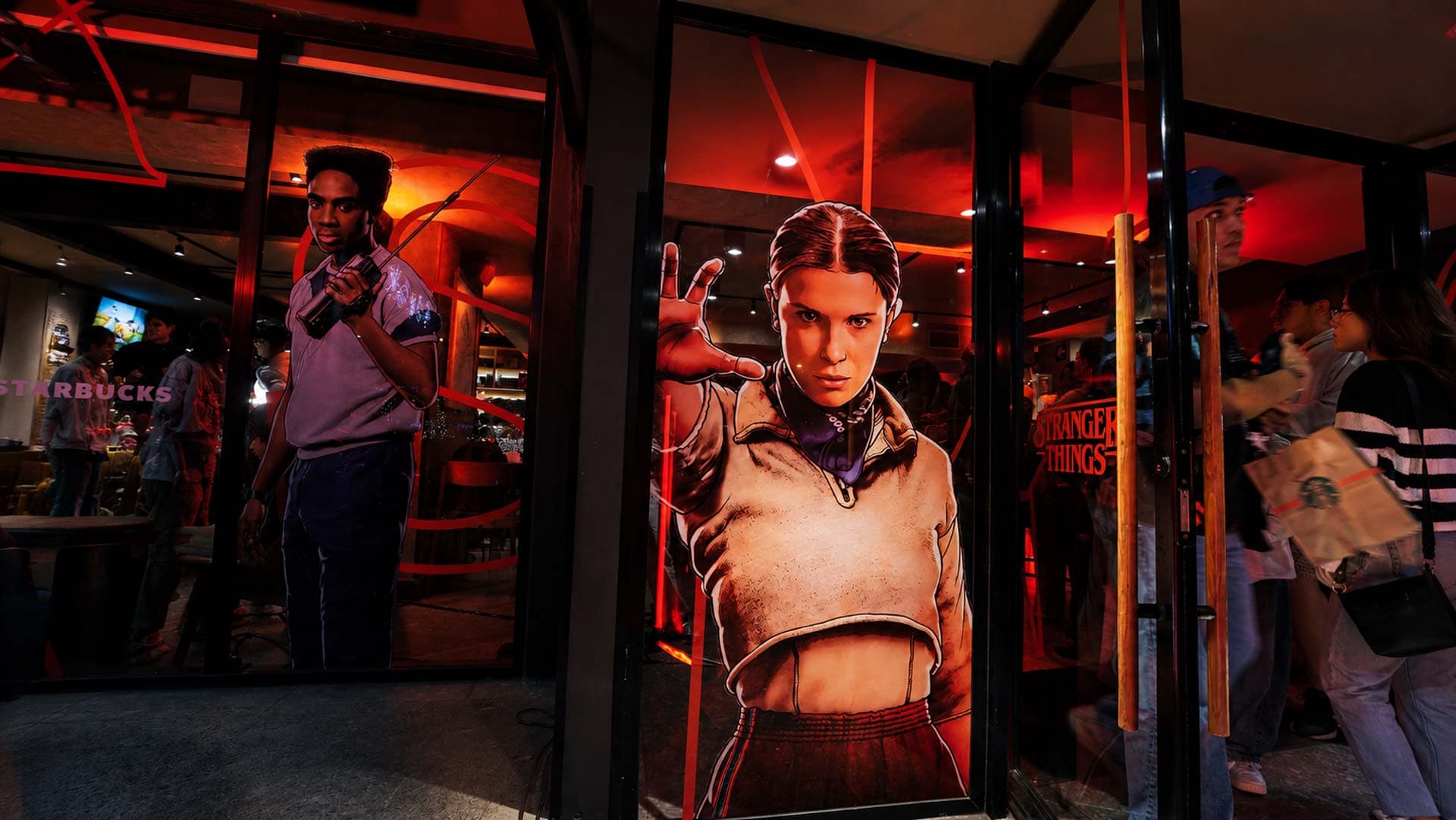 Eleven character poster at illuminated entrance