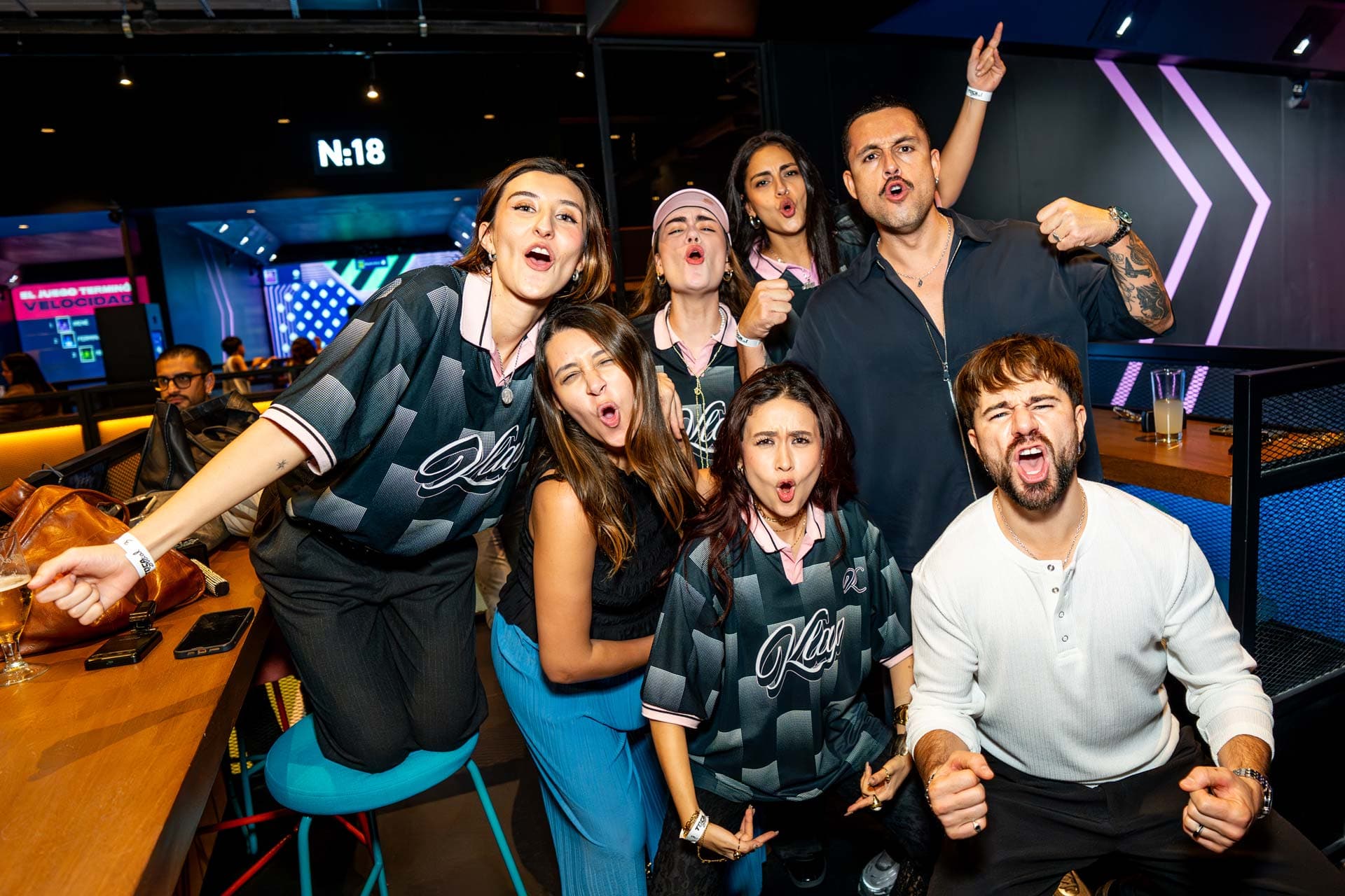 Group of friends celebrating and making funny faces at TOCA Social
