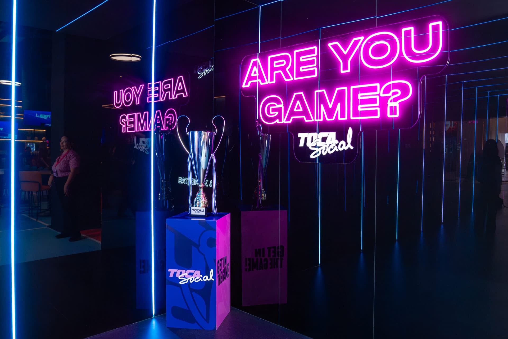 ARE YOU GAME? pink neon sign with silver trophy