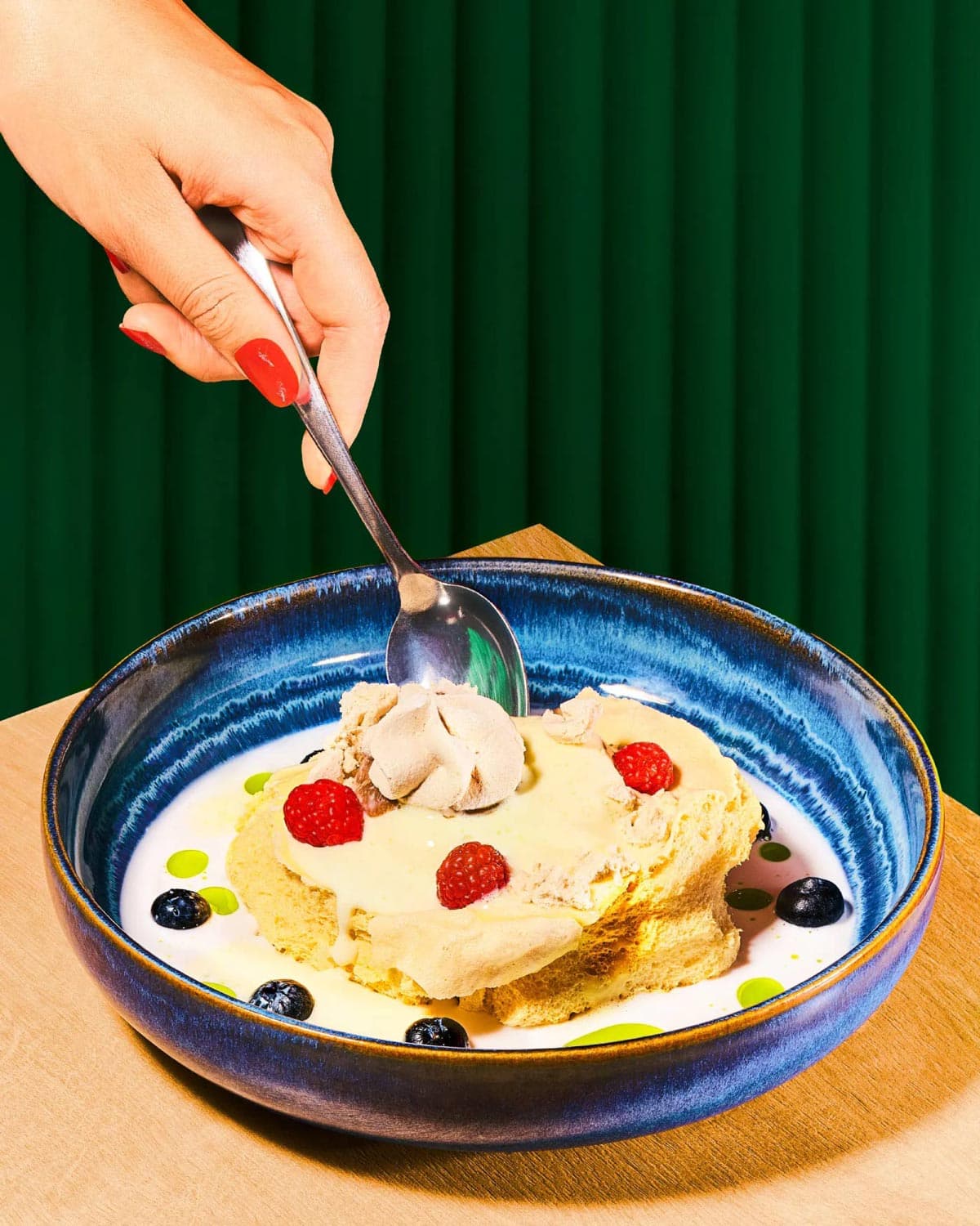 Tasting delicate dessert with spoon