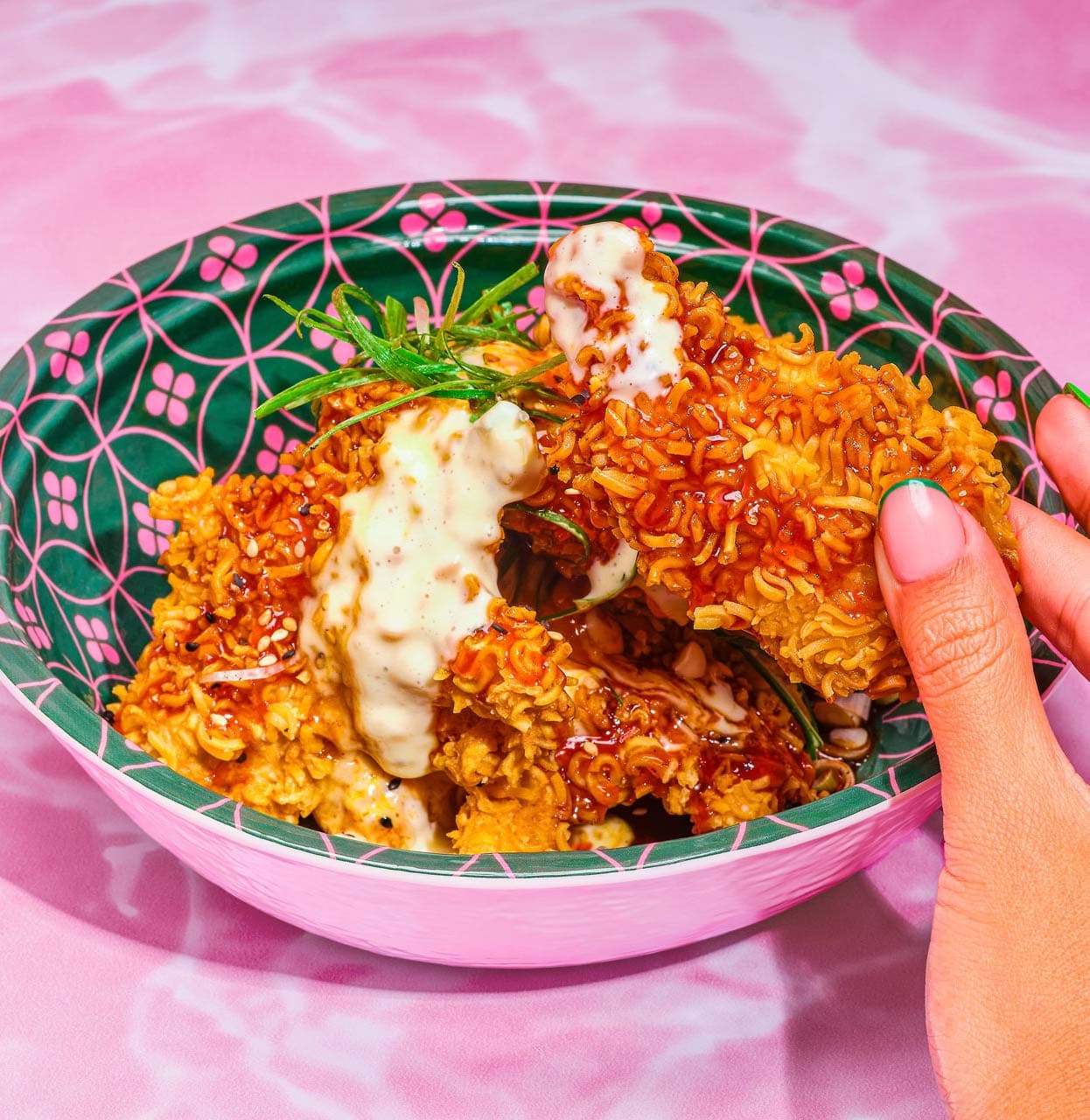 Crispy chicken bowl served with sauce