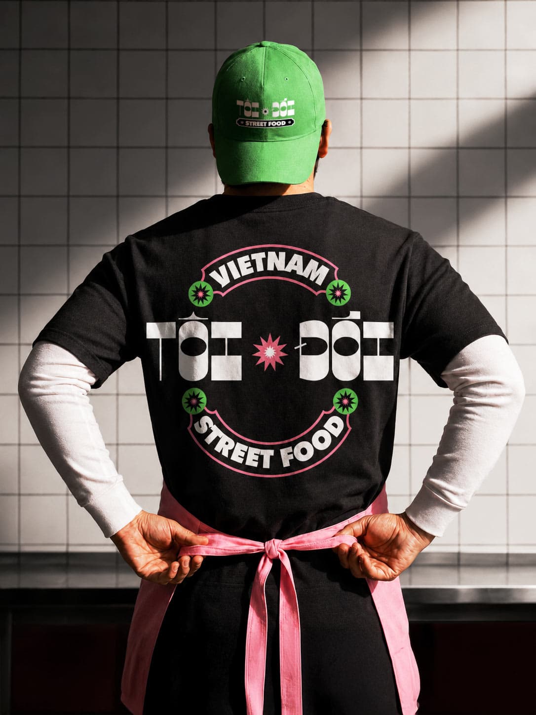 Team member back in branded uniform